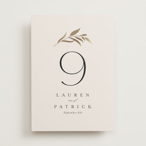 This is a porcelain table numbers with foil pressed by Jennifer Postorino called natural monogram printing on doublethick in standard