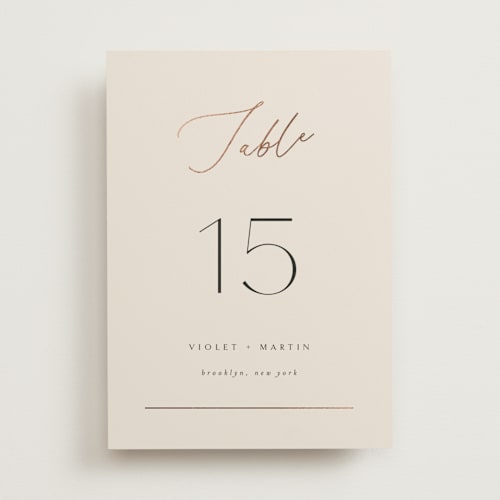 This is a taupe table numbers with foil pressed by Kelly Schmidt called encircled love printing on doublethick in standard