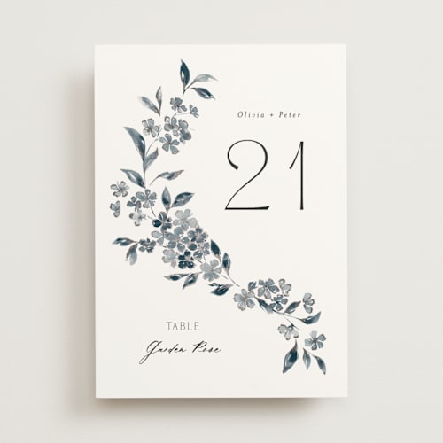 This is a prussian blue table numbers with foil pressed by Itsy Belle Studio called sweeping vine printing on doublethick in standard