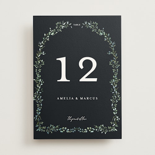 This is a emerald table numbers with foil pressed by Susan Moyal called monogramed arch printing on doublethick in standard