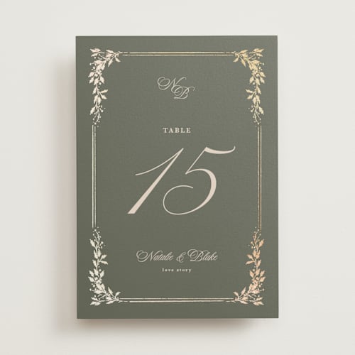This is a sage table numbers with foil pressed by Kate Ahn called lake como printing on doublethick in standard