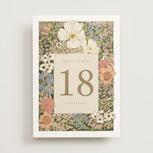 This is a sherbert table numbers with foil pressed by Leah Bisch called in the garden printing on doublethick in standard