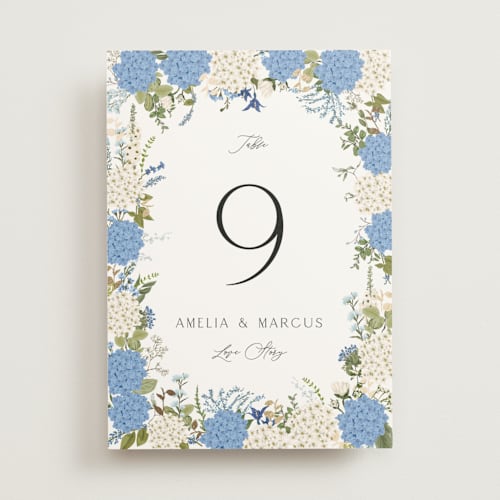 This is a coastal table numbers with foil pressed by Susan Moyal called garden whisper printing on doublethick in standard