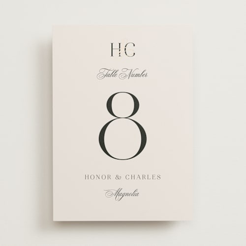 This is a ivory table numbers with foil pressed by Melanie Kosuge called honor printing on doublethick in standard