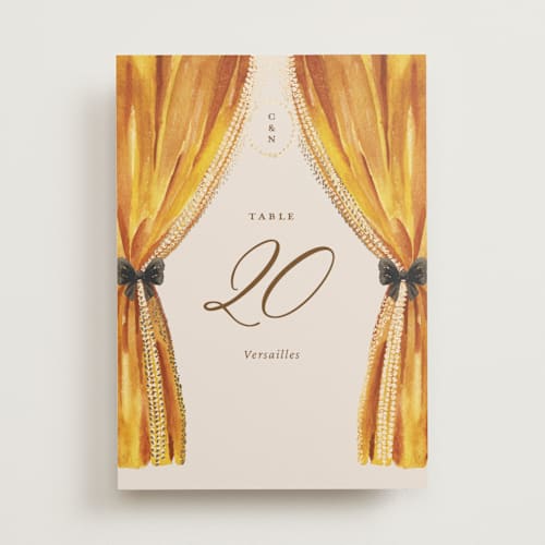 This is a golden table numbers with foil pressed by Claudia Orengo called tuileries printing on doublethick in standard
