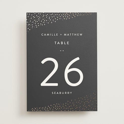This is a soft black table numbers with foil pressed by Camille Robinson called modern glam printing on doublethick in standard