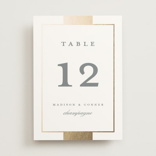 This is a slate table numbers with foil pressed by Stacey Meacham called refined style printing on doublethick in standard