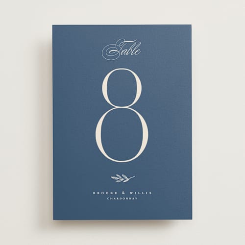 This is a ecru table numbers with standard by Erica Krystek called arched monogram printing on doublethick in standard