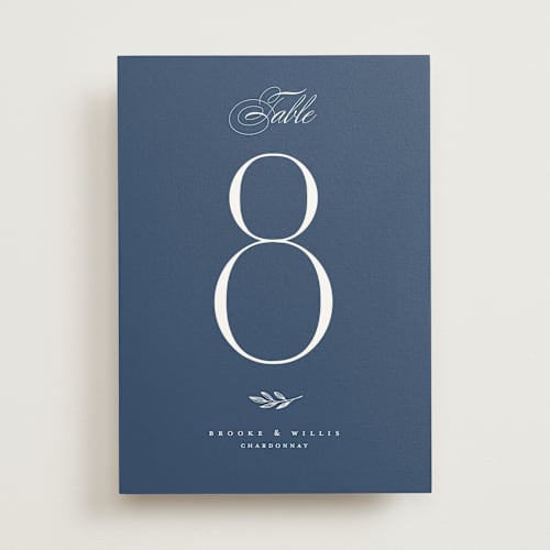 This is a sapphire table numbers with standard by Erica Krystek called arched monogram printing on doublethick in standard