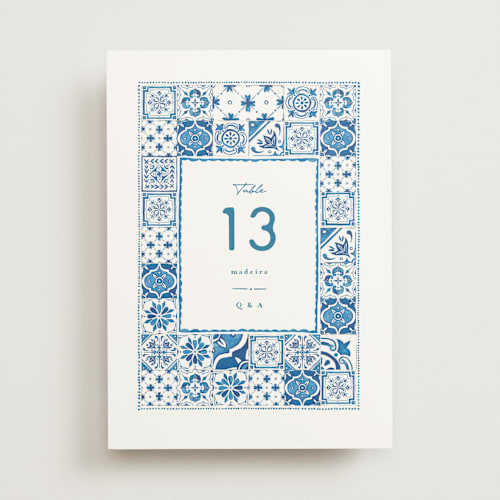 This is a navy table numbers with standard by Anastasia Makarova called watercolor tile printing on doublethick in standard