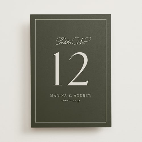 This is a deep olive table numbers with standard by Nicole Walsh called refined printing on doublethick in standard