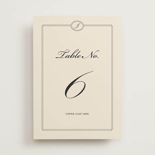 This is a cream table numbers with standard by Ryan Nicole called uptown formal printing on doublethick in standard