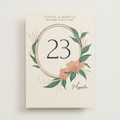 This is a almond table numbers with standard by GeekInk Design called charming printing on doublethick in standard