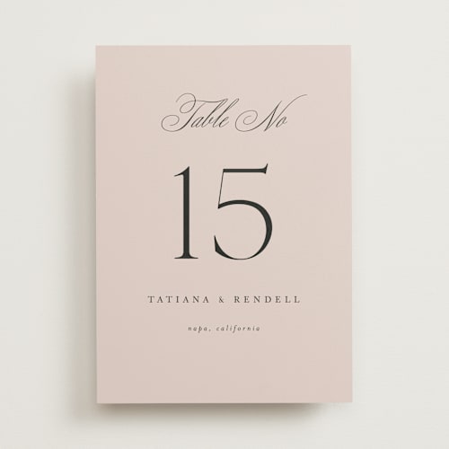 This is a dusty rose table numbers with standard by Kelly Schmidt called arch monogram printing on doublethick in standard