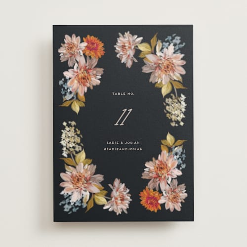 This is a navy table numbers with standard by Olivia Kanaley Inman called dahlia season printing on doublethick in standard