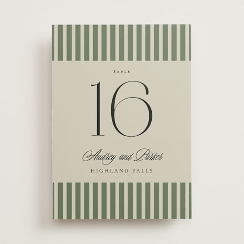 This is a ruby table numbers with standard by Jackie Crawford called holiday ribbon printing on doublethick in standard