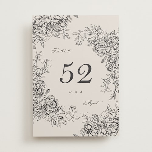 This is a stone table numbers with standard by Phrosné Barwood called etched floral printing on doublethick in standard