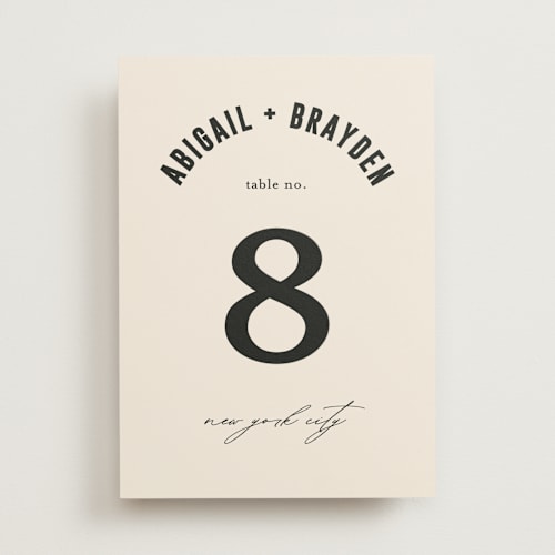 This is a cream table numbers with standard by Pixel and Hank called spin printing on doublethick in standard