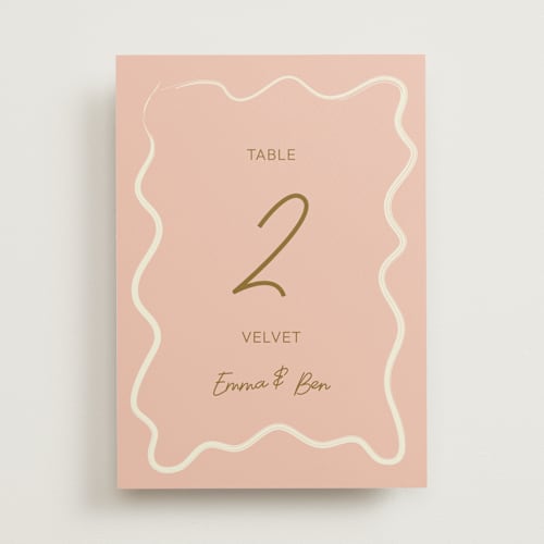 This is a butterscotch table numbers with standard by Helena Vitto called handwritten letter printing on doublethick in standard