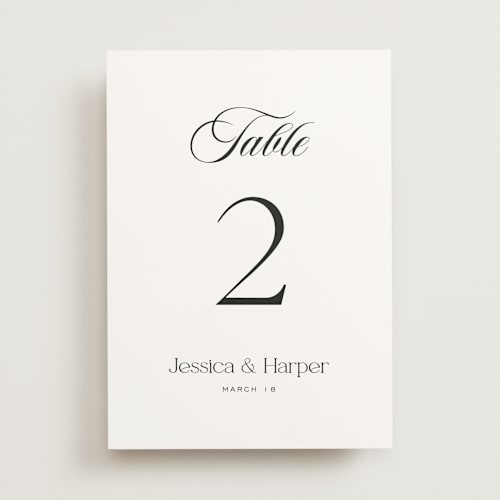 This is a obsidian table numbers with standard by Jennifer Postorino called modern romance printing on doublethick in standard