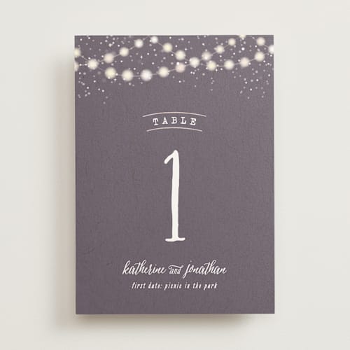 This is a plum table numbers with standard by Hooray Creative called garden lights printing on doublethick in standard