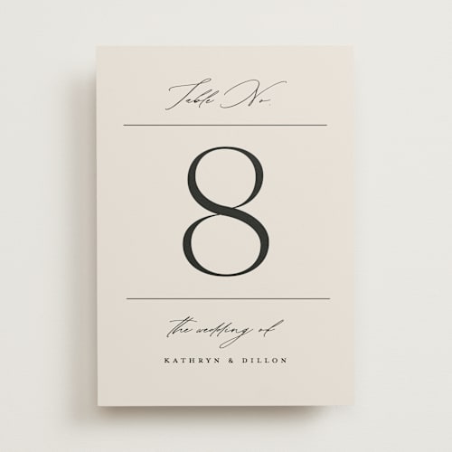 This is a ecru table numbers with standard by Erica Krystek called modern monogram printing on doublethick in standard