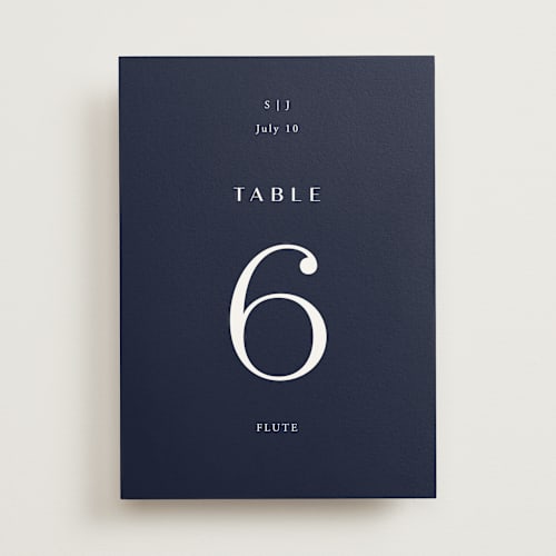 This is a navy table numbers with standard by Annie Shapiro called arguello printing on doublethick in standard