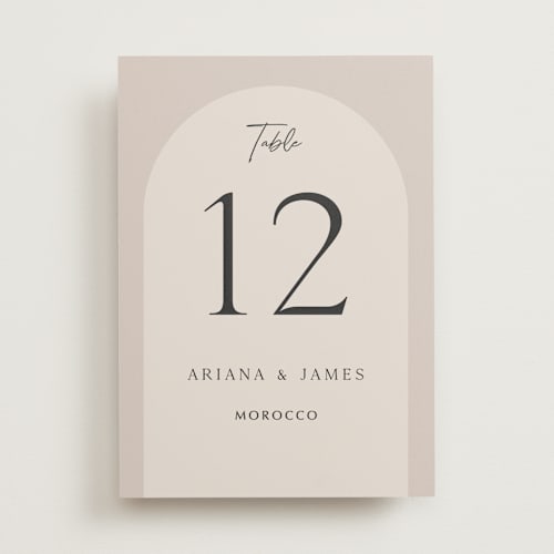 This is a stone table numbers with standard by Elly called the arch printing on signature in standard