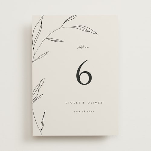 This is a taupe table numbers with standard by Kelly Schmidt called waldorf printing on signature in standard