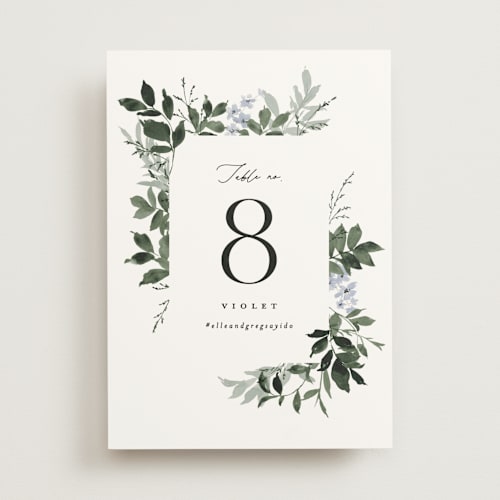 This is a cornflower table numbers with standard by Everett Paper Goods called grove printing on signature in standard