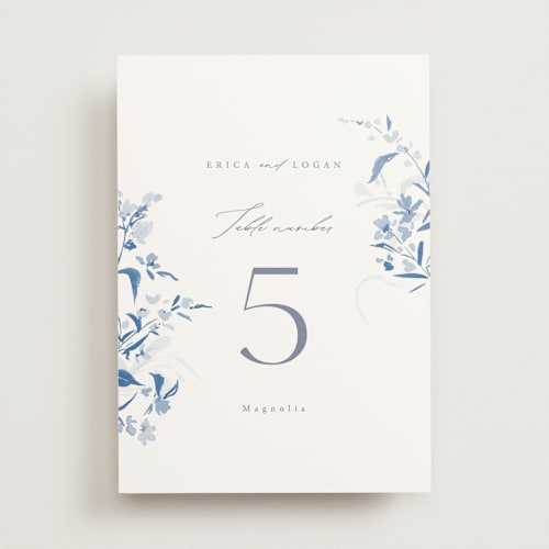 This is a cobalt table numbers with standard by Everett Paper Goods called fleur printing on doublethick in standard