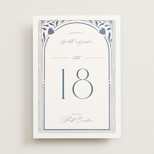 This is a delphinium table numbers with standard by Ashley DeMeyere called nouveau frame printing on doublethick in standard