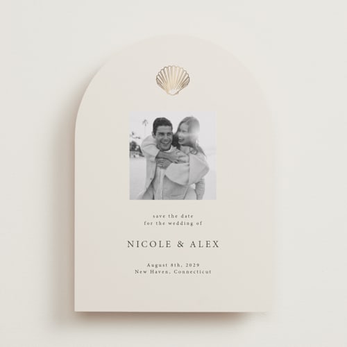 This is a sand foil stamped save the date cards with foil pressed by Hannah Bowman called simple seashell printing on recycled smooth signature in standard