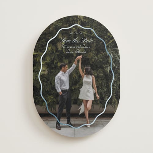 This is a periwinkle foil stamped save the date cards with foil pressed by Baumbirdy called scallop frame printing on recycled smooth signature in standard