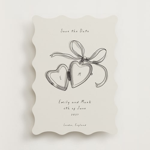 This is a ink wash save the date with standard by Ani Somi called heart shaped locket printing on signature in standard