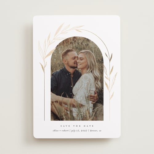This is a silk foil stamped save the date cards with foil pressed by Kelly Schmidt called botanical arches printing on recycled smooth signature in standard