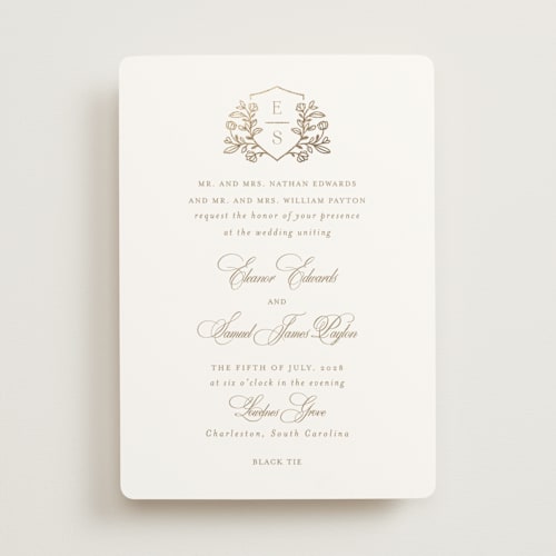 This is a ivory foil stamped wedding invitations with foil pressed by Mansi Verma called gold crest printing on signature in standard