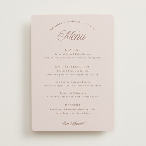 This is a dusty rose menu cards with standard by Hooray Creative called arching type printing on signature in standard