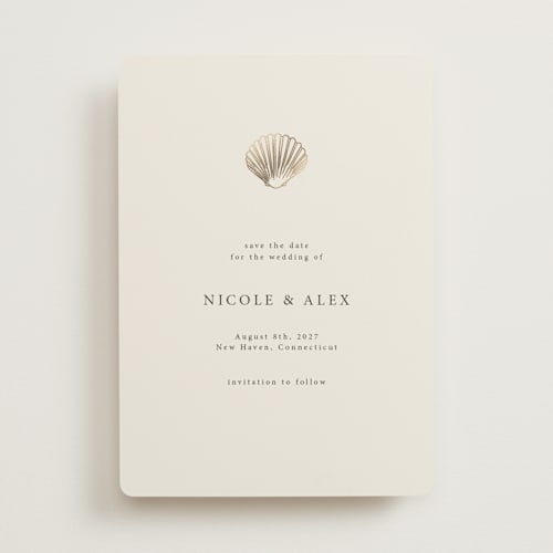 This is a sand foil stamped save the date cards with foil pressed by Hannah Bowman called simple seashell printing on signature in 5x7