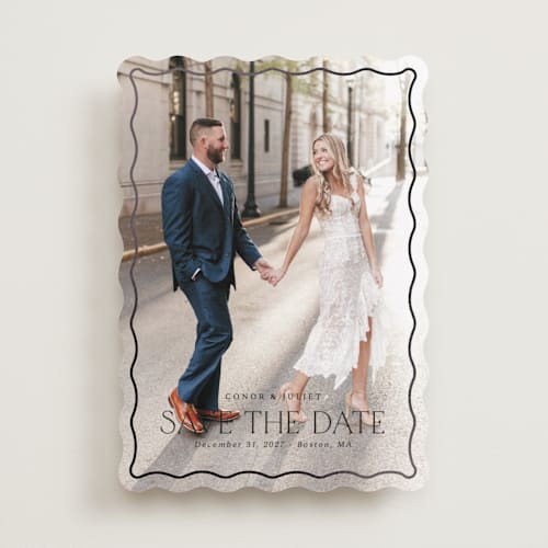 This is a ebony foil stamped save the date cards with foil pressed by Kaydi Bishop called scalloped border printing on recycled smooth signature in standard