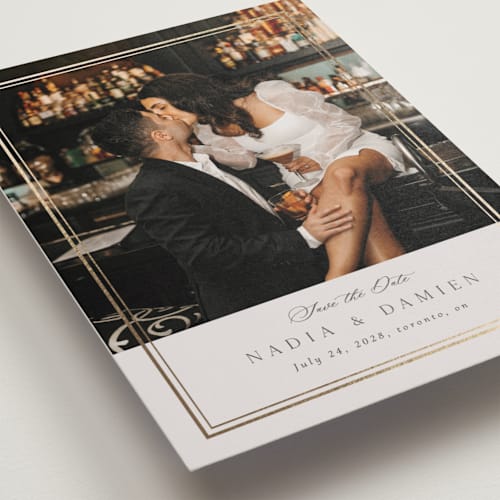 This is a linen foil stamped save the date cards with foil pressed by Nicole Walsh called shimmer printing on recycled smooth signature in grand