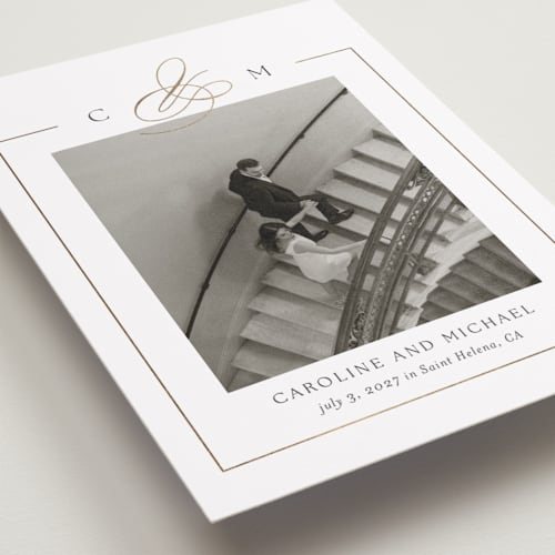 This is a silk foil stamped save the date cards with foil pressed by Kelly Schmidt called framed monogram printing on recycled smooth signature in grand