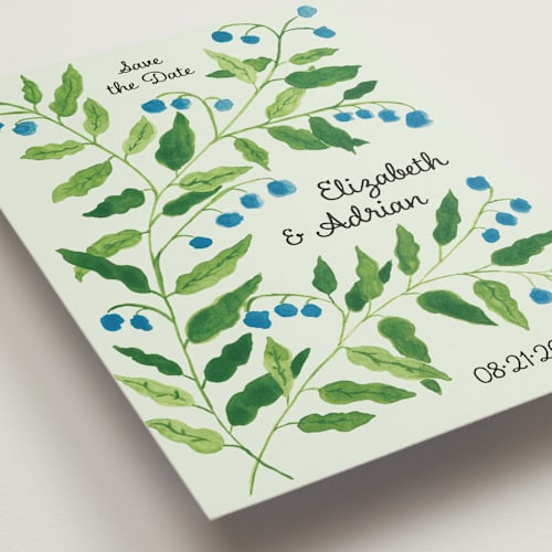 This is a mint save the date with standard by Studio Suku called lily of the valley printing on signature in grand