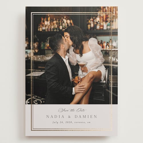 This is a linen foil stamped save the date cards with foil pressed by Nicole Walsh called shimmer printing on recycled smooth signature in grand