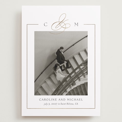 This is a silk foil stamped save the date cards with foil pressed by Kelly Schmidt called framed monogram printing on recycled smooth signature in grand