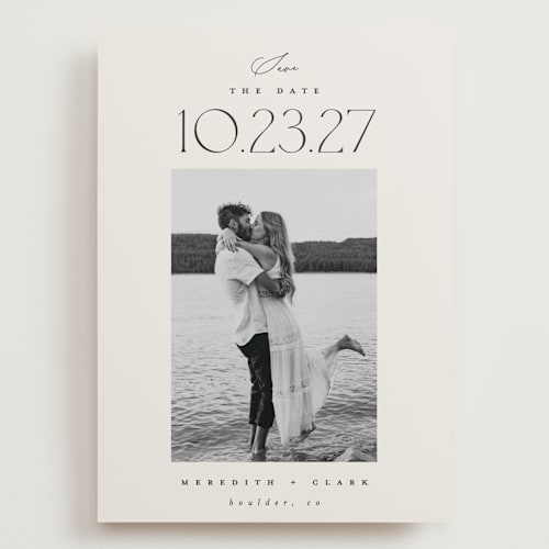 This is a ivory save the date with standard by Carolyn Nicks called romancing the date printing on recycled smooth signature in grand