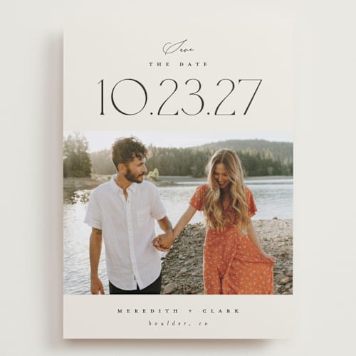 This is a ivory save the date with standard by Carolyn Nicks called romancing the date printing on recycled smooth signature in grand