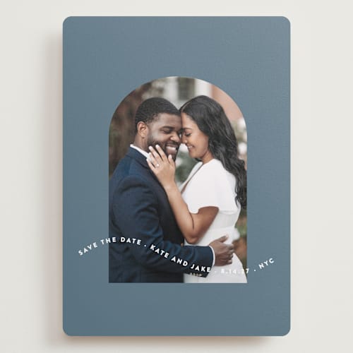This is a dusty blue save the date with standard by Leah Ragain called wavy arch printing on recycled smooth signature in grand