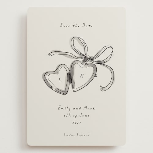 This is a ink wash save the date with standard by Ani Somi called heart shaped locket printing on signature in grand