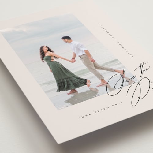 This is a cream petite save the dates with standard by Lori Wemple called posted printing on recycled smooth signature in petite